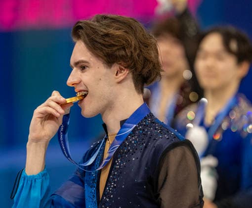 February 14, 2026, Milan, Lombardy, Italy: Kazakhstans MIKHAIL SHAIDOROV takes the gold medal and celebrates by biting down on it after the menÃ¢â‚¬â ¢s Figure skating, Eiskunstlauf Friday at the Milano Ice Skating Arena during this Milano Cortina 2026 Olympics. Milan Italy - ZUMAa35_ 20260214_oly_a35_019 Copyright: xDanielxA.xAndersonx