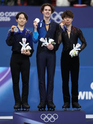 (260214) -- MILAN, Feb. 14, 2026 -- Silver medalist Kagiyama Yuma of Japan, gold medalist Mikhail Shaidorov of Kazakhstan and bronze medalist Sato Shun of Japan (L to R) pose on the podium after the men s single skating free skating of Figure skating, Eiskunstlauf event at the Milan-Cortina 2026 Olympic Winter games, Winterspiele,Spiele, Summer games in Milan, Italy, Feb. 13, 2026. ) (MICO2026)ITALY-MILAN-OLYMPIC WINTER GAMES-FIGURE SKATING-MEN S SINGLE SKATING-FREE SKATING LixMing 