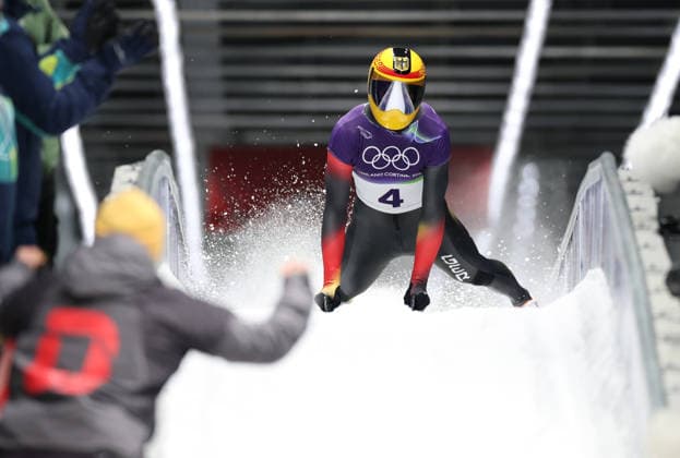 (260214) -- CORTINA D AMPEZZO, Feb. 14, 2026 -- Axel Jungk of Germany reacts after crossing the finish line during the skeleton men competition heat 4 at the Milan-Cortina 2026 Olympic Winter games, Winterspiele,Spiele, Summer games in Cortina, Italy, Feb. 13, 2026. ) (MICO2026)ITALY-CORTINA D AMPEZZO-OLYMPIC WINTER GAMES-SKELETON-MEN DingxXu 
