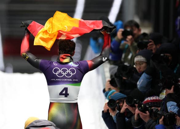 (260214) -- CORTINA D AMPEZZO, Feb. 14, 2026 -- Axel Jungk of Germany celebrates after his competition during the skeleton men competition heat 4 at the Milan-Cortina 2026 Olympic Winter games, Winterspiele,Spiele, Summer games in Cortina, Italy, Feb. 13, 2026. ) (MICO2026)ITALY-CORTINA D AMPEZZO-OLYMPIC WINTER GAMES-SKELETON-MEN DingxXu 