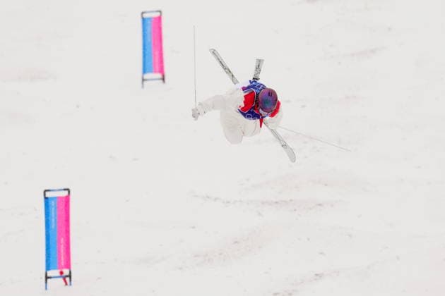February 14, 2026, Livigno, Italy: Canada s Maia Schwinghammer takes a jump during the women s dual moguls 1 8 final at the Milano Cortina 2026 Winter Olympic Games, Olympische Spiele, Olympia, OS in Livigno, Italy, Saturday, Feb. 14, 2026. Canada News - February 14, 2026  - ZUMAc35_ 20260214_zaf_c35_001 Copyright: xSeanxKilpatrickx