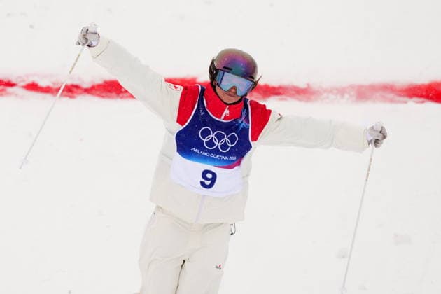 February 14, 2026, Livigno, Italy: Canada s Maia Schwinghammer crosses the finish line during the women s dual moguls 1 8 final at the Milano Cortina 2026 Winter Olympic Games, Olympische Spiele, Olympia, OS in Livigno, Italy, Saturday, Feb. 14, 2026. Canada News - February 14, 2026  - ZUMAc35_ 20260214_zaf_c35_002 Copyright: xSeanxKilpatrickx