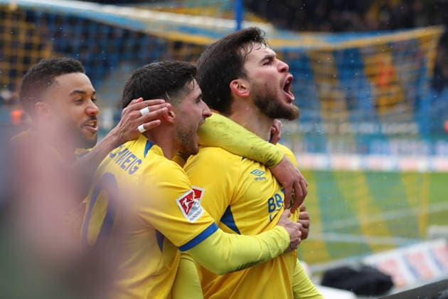 Braunschweig vs Darmstadt, 2 BL Braunschweig, 14 02 2026, Soccer, Men, 2 BL, Season 2025 2026, Eintracht Braunschweig vs SV Darmstadt 98 Mehmet Can Aydin Eintracht Braunschweig cheers with teammates after his penalty goal for 1 0 DFL DFB REGULATIONS PROHIBIT ANY USE OF PHOTOGRAPHS as IMAGE SEQUENCES and or QUASI VIDEO Stadion an der Hamburger Straße Niedersachsen Germany