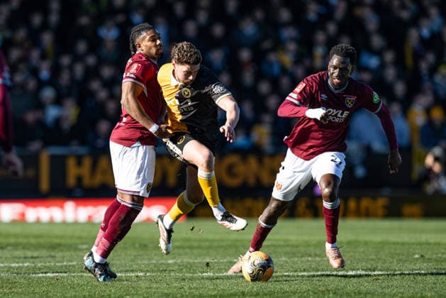14th February 2026; Pirelli Stadium, Burton, West Staffordshire, England; FA Cup Football, Burton Albion versus West Ham United; George Evans of Burton Albion forces his way past Adama Traore of West Ham  GodfreyxPitt Content restricted for UK based newspaper