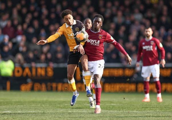 Kain Adom of Burton Albion and Soungoutou Magassa of West Ham United Burton Albion v West Ham United, Emirates FA Cup, Fourth Round, Football, Pirelli Stadium, Burton upon Trent, UK - 14 Feb 2026Burton upon Trent Pirelli Stadium United Kingdom EDITORIAL USE ONLY No use with unauthorised audio, video, data, fixture lists, club league logos or live services. Online in-match use limited to 120 images, no video emulation. No use in betting, games or single club league player publications. Copyright: xRyanxBrowne Shutterstockx 16608141at