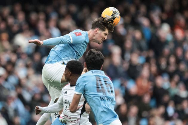 Emirates FA Cup 4th Round Manchester City v Salford City John Stones of Manchester City jumps up to win the high ball during the Emirates FA Cup 4th Round match Manchester City vs Salford City at Etihad Stadium, Manchester, United Kingdom on 14 February 2026 (Photo by Mark Cosgrove News Images) Manchester Etihad Stadium Greater Manchester United, ManU Kingdom Copyright: xMarkxCosgrove NewsxImagesx