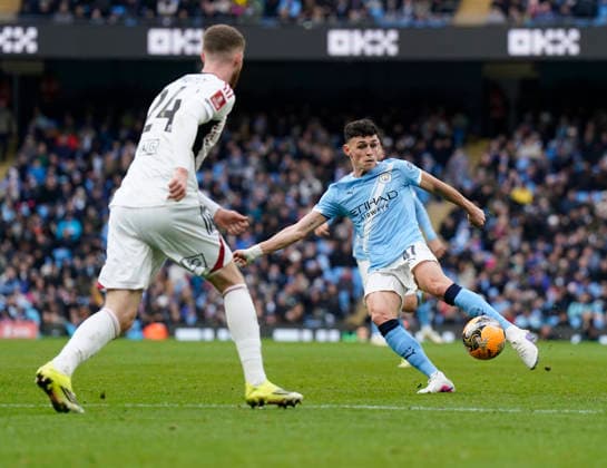 Manchester, England, 14th February 2026. Phil Foden of Manchester City shoots during the Manchester City vs Salford City FA Cup fourth round match at the Etihad Stadium, Manchester. Picture credit should read: Andrew Yates Sportimage EDITORIAL USE ONLY. No use with unauthorised audio, video, data, fixture lists, club league logos or live services. Online in-match use limited to 120 images, no video emulation. No use in betting, games or single club league player publications. SPI_039_AY_Man_City_Salford SPI-4533-0041