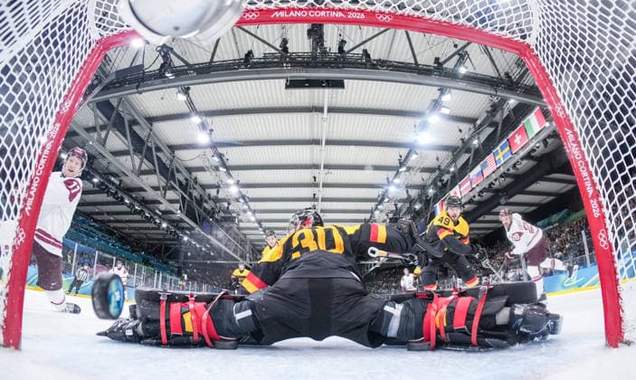 (260214) -- MILAN, Feb. 14, 2026 -- Philipp Grubauer (C), goalkeeper of Germany fails to make a save during the Ice hockey, Eishockey men s preliminary round group C match between Germany and Latvia of the Milan-Cortina 2026 Olympic Winter games, Winterspiele,Spiele, Summer games in Milan, Italy, Feb. 14, 2026. ( Pool via Xinhua) (MICO2026)ITALY-MILAN-OLYMPIC WINTER GAMES-ICE HOCKEY-MEN-PRELIMINARY-GER VS LAT SunxFei 