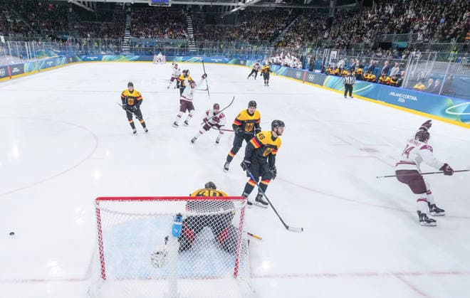 (260214) -- MILAN, Feb. 14, 2026 -- Eduards Tralmaks (1st R) of Latvia celebrates his goal during the Ice hockey, Eishockey men s preliminary round group C match between Germany and Latvia of the Milan-Cortina 2026 Olympic Winter games, Winterspiele,Spiele, Summer games in Milan, Italy, Feb. 14, 2026. ) (MICO2026)ITALY-MILAN-OLYMPIC WINTER GAMES-ICE HOCKEY-MEN-PRELIMINARY-GER VS LAT SunxFei 