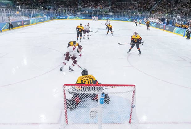 (260214) -- MILAN, Feb. 14, 2026 -- Eduards Tralmaks (2nd L) of Latvia shoots to score during the Ice hockey, Eishockey men s preliminary round group C match between Germany and Latvia of the Milan-Cortina 2026 Olympic Winter games, Winterspiele,Spiele, Summer games in Milan, Italy, Feb. 14, 2026. ) (MICO2026)ITALY-MILAN-OLYMPIC WINTER GAMES-ICE HOCKEY-MEN-PRELIMINARY-GER VS LAT SunxFei 