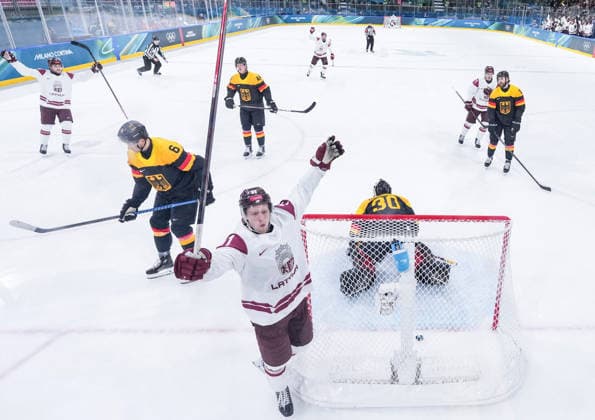 (260214) -- MILAN, Feb. 14, 2026 -- Dans Locmelis (front) of Latvia celebrates his goal during the Ice hockey, Eishockey men s preliminary round group C match between Germany and Latvia of the Milan-Cortina 2026 Olympic Winter games, Winterspiele,Spiele, Summer games in Milan, Italy, Feb. 14, 2026. ) (MICO2026)ITALY-MILAN-OLYMPIC WINTER GAMES-ICE HOCKEY-MEN-PRELIMINARY-GER VS LAT SunxFei 