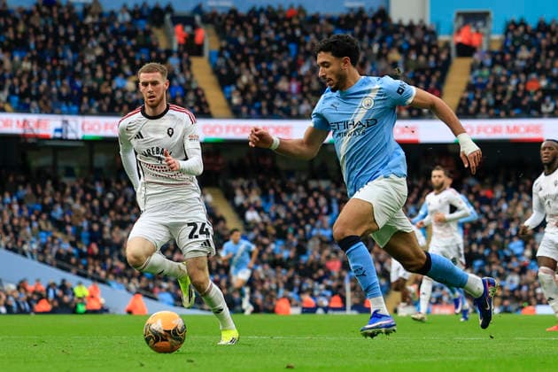 Manchester City v Salford City, FA Cup Omar Marmoush (7) of Manchester City runs with the ball chased by Alfie Dorrington (24) of Salford City during the FA Cup match between Manchester City and Salford City at the Etihad Stadium, Manchester, UK on 14 February 2026. Manchester Etihad Stadium Manchester UK Editorial use only DataCo restrictions apply See www.football-dataco.com , Copyright: xConorxMolloyx PSI-23752-0029