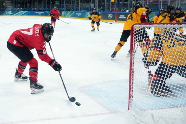 February 14, 2026, Milan, ITALY: Canada s Laura Stacey (7) misses an opening behind Germany goalie Sandra Abstreiter during the first period of a women s hockey quarterfinal game at the 2026 Winter Olympics, in Milan, Saturday, Feb. 14, 2026. Canada News - February 14, 2026  - ZUMAc35_ 20260214_zaf_c35_015 Copyright: xDarrylxDyckx