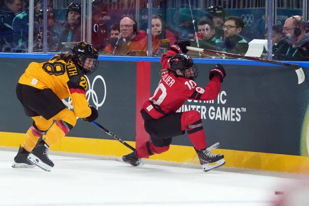 February 14, 2026, Milan, ITALY: Germany s Katarina Jobst-Smith (28) checks Canada s Sarah Fillier (10) during the first period of a women s hockey quarterfinal game at the 2026 Winter Olympics, in Milan, Saturday, Feb. 14, 2026. Canada News - February 14, 2026  - ZUMAc35_ 20260214_zaf_c35_018 Copyright: xDarrylxDyckx