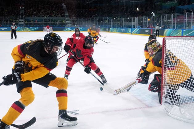 February 14, 2026, Milan, ITALY: Germany goalie Sandra Abstreiter (35) stops Canada s Emily Clark (26) during the first period of a women s hockey quarterfinal game at the 2026 Winter Olympics, in Milan, Saturday, Feb. 14, 2026. Canada News - February 14, 2026  - ZUMAc35_ 20260214_zaf_c35_020 Copyright: xDarrylxDyckx