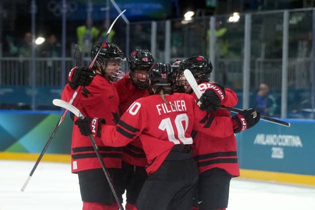 February 14, 2026, Milan, ITALY: Canada s Claire Thompson (42) celebrates her goal with teammates Sophie Jaques (2), Sarah Fillier (10), Kristin O Neill (43) and Daryl Watts (95) during the first period of a women s hockey quarterfinal game against Germany at the 2026 Winter Olympics, in Milan, Saturday, Feb. 14, 2026. Canada News - February 14, 2026  - ZUMAc35_ 20260214_zaf_c35_026 Copyright: xDarrylxDyckx