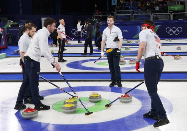 USA s Curling team discuss tactics in their match against Germany in the Round Robin Team Curling match at the 2026 Winter Olympics in Cortina, Italy on Saturday February 14, 2026. USA won the match 8-6.  OLY20260214608 HUGOxPHILPOTT