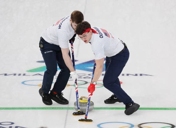 USA s Aidan Oldenburg and Ben Richardson polish the ice in their match against Germany in the Round Robin Team Curling match at the 2026 Winter Olympics in Cortina, Italy on Saturday February 14, 2026. USA won the match 8-6.  OLY20260214621 HUGOxPHILPOTT