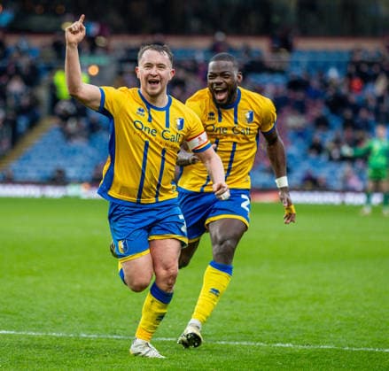 Burnley v Mansfield Town Emirates FA Cup Louis Reed of Mansfield Town celebrates after scoring his sides second goal during the Emirates FA Cup Fourth Round match at Turf Moor, Burnley 14 02 2026 UK Newspapers OUT Copyright: xJamesxHarrisonx FIL-22978-0028