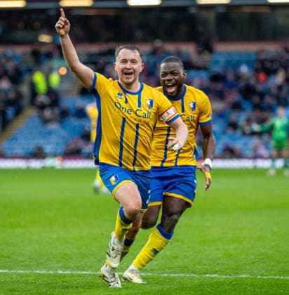 Burnley v Mansfield Town Emirates FA Cup Louis Reed of Mansfield Town celebrates after scoring his sides second goal during the Emirates FA Cup Fourth Round match at Turf Moor, Burnley 14 02 2026 UK Newspapers OUT Copyright: xJamesxHarrisonx FIL-22978-0029