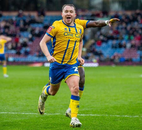 Burnley v Mansfield Town Emirates FA Cup Louis Reed of Mansfield Town celebrates after scoring his sides second goal during the Emirates FA Cup Fourth Round match at Turf Moor, Burnley 14 02 2026 UK Newspapers OUT Copyright: xJamesxHarrisonx FIL-22978-0030