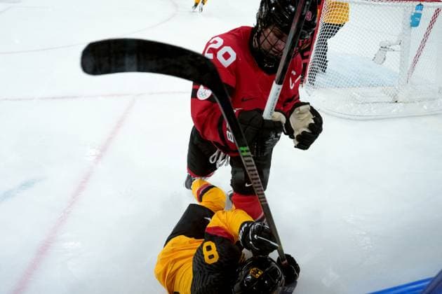 February 14, 2026, Milan, ITALY: Canada s Marie-Philip Poulin (29) checks Germany s Ronja Hark (8) during the second period of a women s hockey quarterfinal game at the 2026 Winter Olympics, in Milan, Saturday, Feb. 14, 2026. Canada News - February 14, 2026  - ZUMAc35_ 20260214_zaf_c35_041 Copyright: xDarrylxDyckx