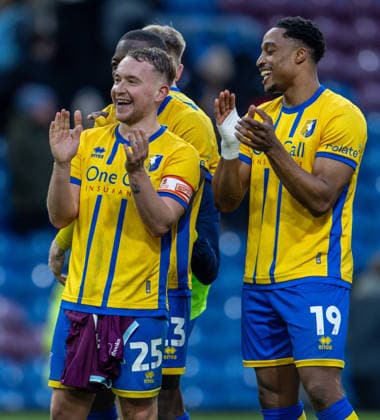Burnley v Mansfield Town Emirates FA Cup Louis Reed (left) and Victor Adeboyejo of Mansfield Town applauds the fans after the Emirates FA Cup Fourth Round match at Turf Moor, Burnley 14 02 2026 UK Newspapers OUT Copyright: xJamesxHarrisonx FIL-22978-0058