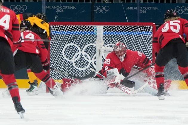 February 14, 2026, Milan, ITALY: Germany s Franziska Feldmeier (7) scores on Canada goalie Emerance Maschmeyer (38) during the third period of a women s hockey quarterfinal game at the 2026 Winter Olympics, in Milan, Saturday, Feb. 14, 2026. Canada News - February 14, 2026  - ZUMAc35_ 20260214_zaf_c35_068 Copyright: xDarrylxDyckx