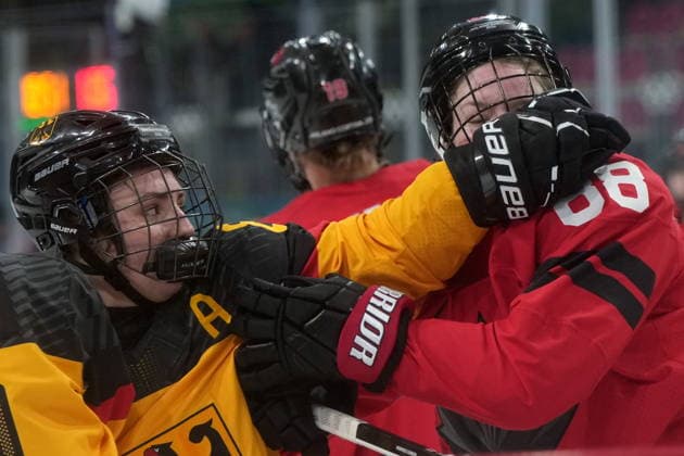 February 14, 2026, Milan, ITALY: Germany s Ronja Hark (8) shoves Canada s Julia Gosling (88) during the third period of a women s hockey quarterfinal game at the 2026 Winter Olympics, in Milan, Saturday, Feb. 14, 2026. Canada News - February 14, 2026  - ZUMAc35_ 20260214_zaf_c35_071 Copyright: xDarrylxDyckx