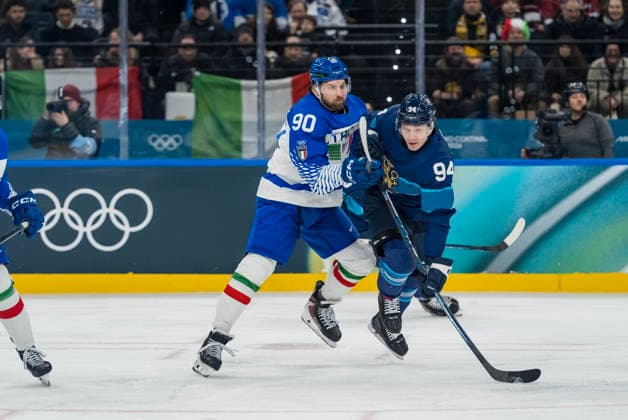 February 14, 2026, Milan, Lombardy, Italy: Defender Dylan Di Perna 90 of Team Italy and Forward Joel Kiviranta 94 of Team Finland fight for the puck during the Team Finland against Team Italy in the Preliminary Round Group B at the Milano Santagiulia Ice hockey, Eishockey Arena in MILAN, Italy during the 2026 Milano Cortina Winter Olympics. Team Finland defeats Team Italy, 11:0. Milan Italy - ZUMAa161 20260214_oly_a161_058 Copyright: xWalterxG.xArcex