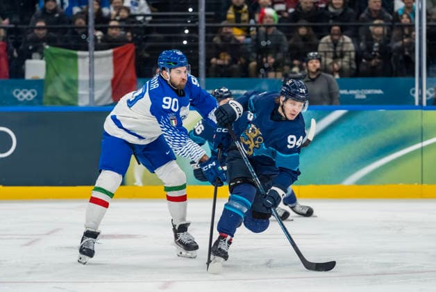 February 14, 2026, Milan, Lombardy, Italy: Defender Dylan Di Perna 90 of Team Italy and Forward Joel Kiviranta 94 of Team Finland fight for the puck during the Team Finland against Team Italy in the Preliminary Round Group B at the Milano Santagiulia Ice hockey, Eishockey Arena in MILAN, Italy during the 2026 Milano Cortina Winter Olympics. Team Finland defeats Team Italy, 11:0. Milan Italy - ZUMAa161 20260214_oly_a161_061 Copyright: xWalterxG.xArcex
