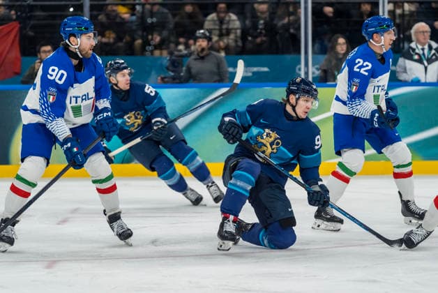 February 14, 2026, Milan, Lombardy, Italy: Defender Dylan Di Perna 90 of Team Italy and Forward Joel Kiviranta 94 of Team Finland fight for the puck during the Team Finland against Team Italy in the Preliminary Round Group B at the Milano Santagiulia Ice hockey, Eishockey Arena in MILAN, Italy during the 2026 Milano Cortina Winter Olympics. Team Finland defeats Team Italy, 11:0. Milan Italy - ZUMAa161 20260214_oly_a161_063 Copyright: xWalterxG.xArcex