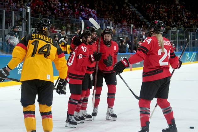February 14, 2026, Milan, ITALY: Canada s Marie-Philip Poulin (29) celebrates her goal with teammates during the third period of a women s hockey quarterfinal game against Germany at the 2026 Winter Olympics, in Milan, Saturday, Feb. 14, 2026. Canada News - February 14, 2026  - ZUMAc35_ 20260214_zaf_c35_075 Copyright: xDarrylxDyckx