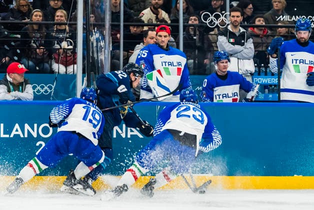 February 14, 2026, Milan, Lombardy, Italy: Forward Mikael Granlund 64 of Team Finland fights for the puck against Team Italy in the Preliminary Round Group B at the Milano Santagiulia Ice hockey, Eishockey Arena in MILAN, Italy during the 2026 Milano Cortina Winter Olympics. Milan Italy - ZUMAa161 20260214_oly_a161_095 Copyright: xWalterxG.xArcex
