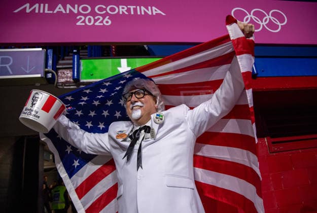 February 14, 2026, Milano, Lombardy, Italy: American fan Tim Quinn of Cleveland dresses as Col, Sanders from Kentucky Fired Chicken at the Short Track Speed skating, Eisschnelllauf Mens 1500m quarterfinals during the 2026 Winter Olympics at the Milano Ice Skating Arena on Saturday in Milano. Olympics 2026: Milano Cortina: Short Track Speed Skating Men s  - ZUMAj89_ 20260214_oly_j89_001 Copyright: xPaulxKitagakixJr.x