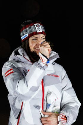 OLYMPICS - Winter Olympic Games, Olympische Spiele, Olympia, OS Milano Cortina 2026 CORTINA D AMPEZZO,ITALY,14.FEB.26 - OLYMPICS, SKELETON - Winter Olympic Games Milano Cortina 2026, women, medal ceremony. Image shows the rejoicing of Janine Flock (AUT). Keyword: medal.  GEPAxpictures xMaticxKlansek