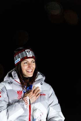 OLYMPICS - Winter Olympic Games, Olympische Spiele, Olympia, OS Milano Cortina 2026 CORTINA D AMPEZZO,ITALY,14.FEB.26 - OLYMPICS, SKELETON - Winter Olympic Games Milano Cortina 2026, women, medal ceremony. Image shows the rejoicing of Janine Flock (AUT). Keyword: medal.  GEPAxpictures xMaticxKlansek