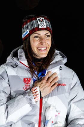 OLYMPICS - Winter Olympic Games, Olympische Spiele, Olympia, OS Milano Cortina 2026 CORTINA D AMPEZZO,ITALY,14.FEB.26 - OLYMPICS, SKELETON - Winter Olympic Games Milano Cortina 2026, women, medal ceremony. Image shows the rejoicing of Janine Flock (AUT). Keyword: medal.  GEPAxpictures xMaticxKlansek