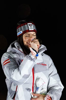 OLYMPICS - Winter Olympic Games, Olympische Spiele, Olympia, OS Milano Cortina 2026 CORTINA D AMPEZZO,ITALY,14.FEB.26 - OLYMPICS, SKELETON - Winter Olympic Games Milano Cortina 2026, women, medal ceremony. Image shows the rejoicing of Janine Flock (AUT). Keyword: medal.  GEPAxpictures xMaticxKlansek