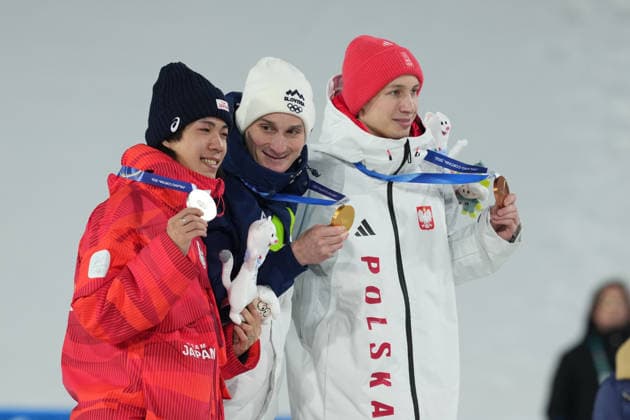 Milano Cortina 2026 Olympic Winter games, Winterspiele,Spiele, Summer games MILAN, ITALY - FEBRUARY 14: Slovenian athlete Domen Prevc (C) wins gold medal, Japanese athlete Ren Nikaido (L) wins silver medal and Polish athlete Kacper Tomasiak (R) wins bronze medal in the men’s large hill Ski jumping, Skispringen, Ski, nordisch event during the Milano-Cortina 2026 Winter Olympic Games, Olympische Spiele, Olympia, OS in Milan, Italy, on February 14, 2026. Cemal Yurttas Anadolu Milan Italy. Editorial use only. Please get in touch for any other usage.  Copyright: x2026xAnadoluxCemalxYurttasx