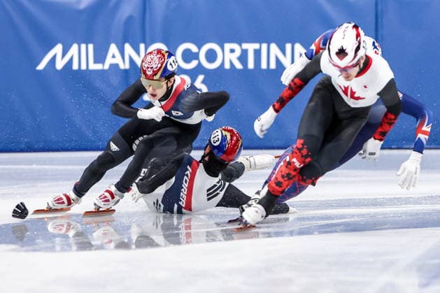 ITALY, MILAN - FEBRUARY 14, 2026: Shin Dong-min. Rim Jong-un of South Korea and Felix Roussel (L-R) of Canada compete in the men s 1,500m short-track Speed skating, Eisschnelllauf quarterfinals during the 2026 Winter Olympic Games, Olympische Spiele, Olympia, OS at the Milano Ice Skating Arena. Peter Kovalev TASS  88712139