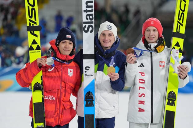 Milano Cortina 2026 Olympic Winter games, Winterspiele,Spiele, Summer games MILAN, ITALY - FEBRUARY 14: Slovenian athlete Domen Prevc (C) wins gold medal, Japanese athlete Ren Nikaido (L) wins silver medal and Polish athlete Kacper Tomasiak (R) wins bronze medal in the men’s large hill Ski jumping, Skispringen, Ski, nordisch event during the Milano-Cortina 2026 Winter Olympic Games, Olympische Spiele, Olympia, OS in Milan, Italy, on February 14, 2026. Cemal Yurttas Anadolu Milan Italy. Editorial use only. Please get in touch for any other usage.  Copyright: x2026xAnadoluxCemalxYurttasx