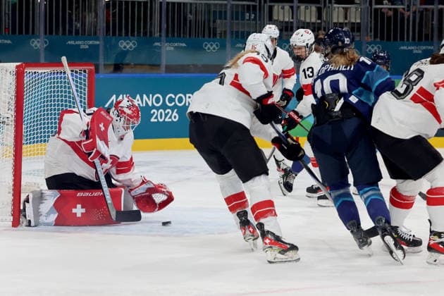 February 14, 2026, Milan, Lombardy, Italy: Andrea Braendli 20 of Team Switzerland blocks shot by Elisa Holopainen 10 of Team Finland in a women s Ice hockey, Eishockey quarterfinal during the Milano Cortina 2026 Olympic Winter games, Winterspiele,Spiele, Summer games at Milano Rho Ice Hockey Arena. Olympics 2026: Milano Cortina: Ice Hockey-Women Quarterfinal - FIN-SUI  - ZUMAm117 20260214_oly_m117_001 Copyright: xDavidxMcIntyrex