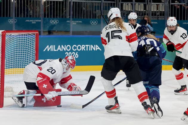 February 14, 2026, Milan, Lombardy, Italy: Andrea Braendli 20 of Team Switzerland blocks shot by Elisa Holopainen 10 of Team Finland in a women s Ice hockey, Eishockey quarterfinal during the Milano Cortina 2026 Olympic Winter games, Winterspiele,Spiele, Summer games at Milano Rho Ice Hockey Arena. Olympics 2026: Milano Cortina: Ice Hockey-Women Quarterfinal - FIN-SUI  - ZUMAm117 20260214_oly_m117_003 Copyright: xDavidxMcIntyrex