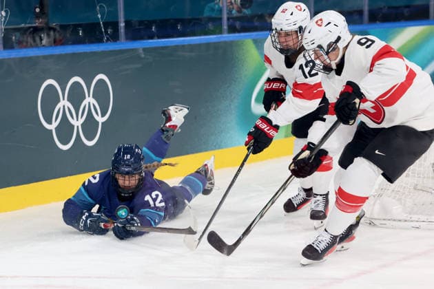 February 14, 2026, Milan, Lombardy, Italy: Sanni Vanhanen 12 of Team Finland and Lisa Ruedi 12 of Team Switzerland in a women s Ice hockey, Eishockey quarterfinal during the Milano Cortina 2026 Olympic Winter games, Winterspiele,Spiele, Summer games at Milano Rho Ice Hockey Arena. Olympics 2026: Milano Cortina: Ice Hockey-Women Quarterfinal - FIN-SUI  - ZUMAm117 20260214_oly_m117_043 Copyright: xDavidxMcIntyrex