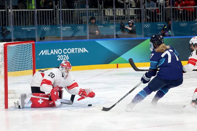 February 14, 2026, Milan, Lombardy, Italy: Andrea Braendli 20 of Team Switzerland blocks shot by Susanna Tapani 77 of Team Finland in a women s Ice hockey, Eishockey quarterfinal during the Milano Cortina 2026 Olympic Winter games, Winterspiele,Spiele, Summer games at Milano Rho Ice Hockey Arena. Milan Italy - ZUMAm117 20260214_oly_m117_044 Copyright: xDavidxMcIntyrex