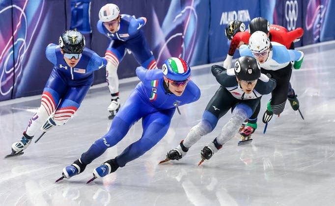 ITALY, MILAN - FEBRUARY 14, 2026: Andrew Heo of the US, Luca Spechenhauser of Italy and Keita Watanabe (L-R front) of Japan compete in Final B of the men s 1,500m short-track Speed skating, Eisschnelllauf event during the 2026 Winter Olympic Games, Olympische Spiele, Olympia, OS at the Milano Ice Skating Arena. Peter Kovalev TASS  88719560