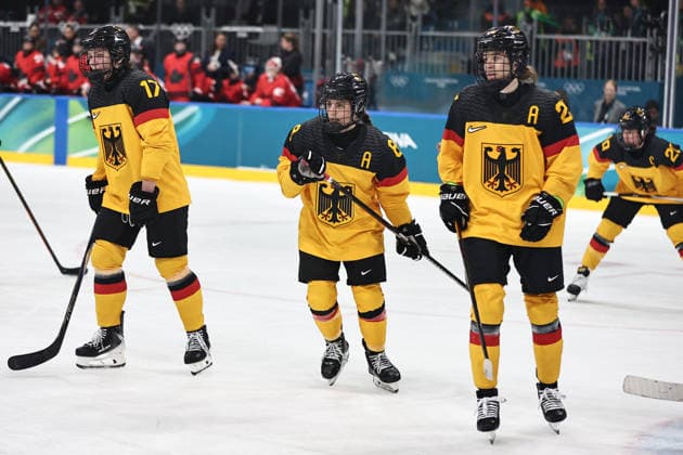 Emily Nix, Ronja Hark and Daria Gleissner, GER, during preliminaries (CAN - GER) at 2026 Ice hockey, Eishockey Olympic Games, Olympische Spiele, Olympia, OS in Milan; 14 02 2026 - *** Emily Nix, Ronja Hark and Daria Gleissner, GER, during preliminaries CAN GER at 2026 ice hockey olympic games in Milan 14 02 2026 
