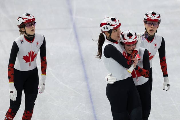 February 14, 2026, Milano, Lombardy, Italy: Courtney Sarault (14) of Canada and Kim Boutin (13) of Canada hugs after qualifying for the final in Short Track Speed skating, Eisschnelllauf Women 3000m relay during the semifinals during the 2026 Winter Olympics at the Milano Ice Skating Arena on Saturday in Milano. Milano Italy - ZUMAj89_ 20260214_oly_j89_037 Copyright: xPaulxKitagakixJr.x