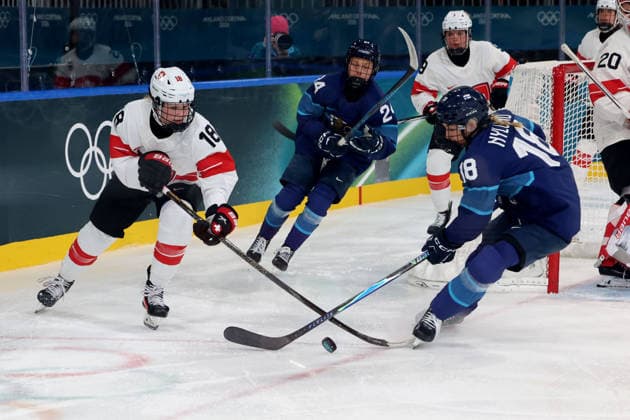 February 14, 2026, Milan, Lombardy, Italy: Jenniina Nylund 18 of Team Finland and Stefanie Wetli 18 of Team Switzerland in a women s Ice hockey, Eishockey quarterfinal during the Milano Cortina 2026 Olympic Winter games, Winterspiele,Spiele, Summer games at Milano Rho Ice Hockey Arena. Milan Italy - ZUMAm117 20260214_oly_m117_054 Copyright: xDavidxMcIntyrex